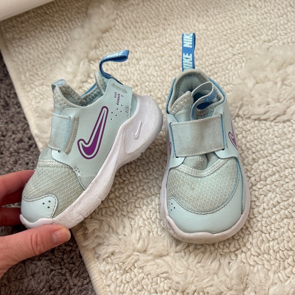 Nike Kids Light Blue Slip-On Sneakers with Purple Swoosh